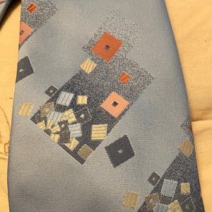 Men’s 1970s vintage Tie. Beautiful light blue color with geometric shapes on it.